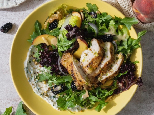 Made with our signature salt & pepper chicken, blackberries, stone fruit, pistachios, almonds, Di Stefano ricotta cheese, baby head lettuces, dandelion greens, & caramelized onion vinaigrette.